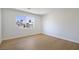 Bright bedroom featuring wood flooring and a large window with a view at 1371 Cumulus Ct, Henderson, NV 89014
