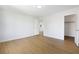 Bright bedroom featuring wood flooring, and a view of the hallway and closet at 1371 Cumulus Ct, Henderson, NV 89014