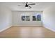 Bedroom featuring a ceiling fan and two windows with neighborhood views at 1371 Cumulus Ct, Henderson, NV 89014