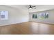 Large bedroom featuring wood flooring and bright windows with views at 1371 Cumulus Ct, Henderson, NV 89014