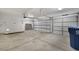 Spacious three-car garage with multiple garage doors and concrete flooring at 1371 Cumulus Ct, Henderson, NV 89014