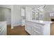 Modern kitchen featuring white cabinets, countertops, and an island with lots of storage at 1371 Cumulus Ct, Henderson, NV 89014