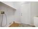 Laundry room with utility connections, a door and floating shelf at 1371 Cumulus Ct, Henderson, NV 89014