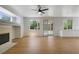 Spacious living area with fireplace, large windows, and sliding door to the backyard at 1371 Cumulus Ct, Henderson, NV 89014