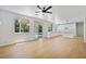 Open-concept living area featuring lots of natural light, hardwood floors and backyard access at 1371 Cumulus Ct, Henderson, NV 89014