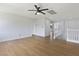 Bright and spacious loft featuring modern flooring and a ceiling fan at 1371 Cumulus Ct, Henderson, NV 89014