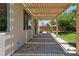 Covered patio offering shade and a view of the backyard, ideal for relaxing or entertaining outdoors at 1371 Cumulus Ct, Henderson, NV 89014