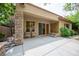 Backyard patio area with stone pillars and a cozy outdoor seating area at 15 Emerald Dunes Cir, Henderson, NV 89052