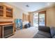 Comfortable bonus room with wet bar, outdoor access, and a relaxing atmosphere at 15 Emerald Dunes Cir, Henderson, NV 89052
