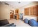 Comfortable bonus room with wet bar, outdoor access, and a relaxing atmosphere at 15 Emerald Dunes Cir, Henderson, NV 89052
