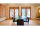 Dining area with seating for four and a view of the backyard at 15 Emerald Dunes Cir, Henderson, NV 89052