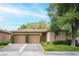 Charming single-story home with well-manicured landscaping and a two-car garage at 15 Emerald Dunes Cir, Henderson, NV 89052