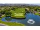 Beautiful golf course view with a water feature, fountain, and well-manicured green at 15 Emerald Dunes Cir, Henderson, NV 89052