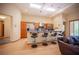 Open kitchen boasts stainless steel appliances, breakfast bar with seating, and wood cabinets at 15 Emerald Dunes Cir, Henderson, NV 89052