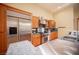 Kitchen with stainless steel appliances, wood cabinets, and a grey countertop at 15 Emerald Dunes Cir, Henderson, NV 89052