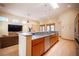 Open-concept kitchen with stainless steel appliances and a view of the living area at 15 Emerald Dunes Cir, Henderson, NV 89052