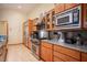 Chef's kitchen featuring stainless steel appliances, granite countertops, and ample cabinet space at 15 Emerald Dunes Cir, Henderson, NV 89052