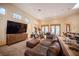 Open-concept living room with a kitchen and dining area at 15 Emerald Dunes Cir, Henderson, NV 89052