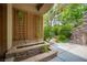Landscaped patio area featuring stone accents, greenery, and a tranquil outdoor space at 15 Emerald Dunes Cir, Henderson, NV 89052