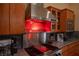 Close up of the range and vent in the kitchen at 15 Emerald Dunes Cir, Henderson, NV 89052