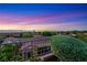 Inviting backyard view showcasing the landscape, neighborhood, and desert vista beyond at 1637 Wellington Springs Ave, Henderson, NV 89052