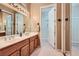 Bathroom featuring double sinks and a walk-in shower at 1637 Wellington Springs Ave, Henderson, NV 89052