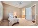 Comfortable bedroom with plantation shutters and a ceiling fan at 1637 Wellington Springs Ave, Henderson, NV 89052