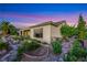 Charming home exterior with well-maintained landscaping and a private backyard oasis at 1637 Wellington Springs Ave, Henderson, NV 89052
