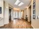 Inviting foyer with hardwood floors, skylight, and an elegant double door entrance at 1637 Wellington Springs Ave, Henderson, NV 89052