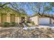 Inviting single-story home with desert landscaping and stone pathway leading to the front entrance at 1637 Wellington Springs Ave, Henderson, NV 89052