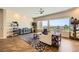 Bright living room with hardwood floors, large windows offering scenic views, and comfortable seating at 1637 Wellington Springs Ave, Henderson, NV 89052