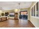 Elegant living room with wood floors, bright chandelier, and exterior mountain views at 1637 Wellington Springs Ave, Henderson, NV 89052