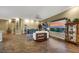Spacious living room with wood floors, seating area, and mountain views at 1637 Wellington Springs Ave, Henderson, NV 89052