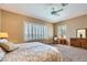 Spacious main bedroom with plantation shutters, carpeted floors, and a ceiling fan at 1637 Wellington Springs Ave, Henderson, NV 89052