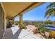 Covered patio with hot tub and desert landscaping offers stunning mountain views at 1637 Wellington Springs Ave, Henderson, NV 89052
