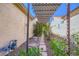 Side yard with decorative lattice and stone pathway at 1637 Wellington Springs Ave, Henderson, NV 89052