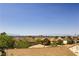 Distant city and mountain views from a residential neighborhood at 1637 Wellington Springs Ave, Henderson, NV 89052