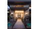 Unique front entrance with bridge over water feature and custom privacy screen at 17 Soaring Bird Ct, Las Vegas, NV 89135