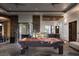 Entertainers' dream game room with pool table, bar, and seamless indoor-outdoor living at 17 Soaring Bird Ct, Las Vegas, NV 89135