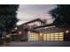 Contemporary home exterior with three-car garage and modern design elements at 17 Soaring Bird Ct, Las Vegas, NV 89135