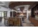 Gourmet kitchen boasts custom cabinets, granite countertops, and dual islands with seating at 17 Soaring Bird Ct, Las Vegas, NV 89135