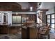 Gourmet kitchen featuring custom cabinets, granite countertops and dual islands with seating at 17 Soaring Bird Ct, Las Vegas, NV 89135