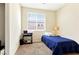 Well-lit bedroom featuring a single bed and a functional workspace with a window at 2079 Port Royal Dr, Laughlin, NV 89029