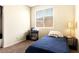 Well-lit bedroom featuring a single bed and a functional workspace with a window at 2079 Port Royal Dr, Laughlin, NV 89029