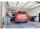 Organized garage space featuring a car, ample storage, and an automatic door for convenient vehicle parking at 2079 Port Royal Dr, Laughlin, NV 89029