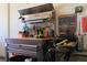 Garage workbench featuring tools, a stainless steel hood, and a pegboard for convenient organization at 2079 Port Royal Dr, Laughlin, NV 89029