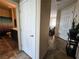 Hallway with tile flooring leading to a bathroom and living area with natural light at 2079 Port Royal Dr, Laughlin, NV 89029