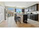 Stylish kitchen with a central island, stainless steel appliances, and sliding glass doors to the outdoor patio at 2079 Port Royal Dr, Laughlin, NV 89029