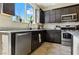 The kitchen features granite countertops, stainless steel appliances, and dark cabinetry offering a modern cooking space at 2079 Port Royal Dr, Laughlin, NV 89029