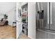 Open pantry in kitchen with stainless steel refrigerator and visible access to the living room space at 2079 Port Royal Dr, Laughlin, NV 89029